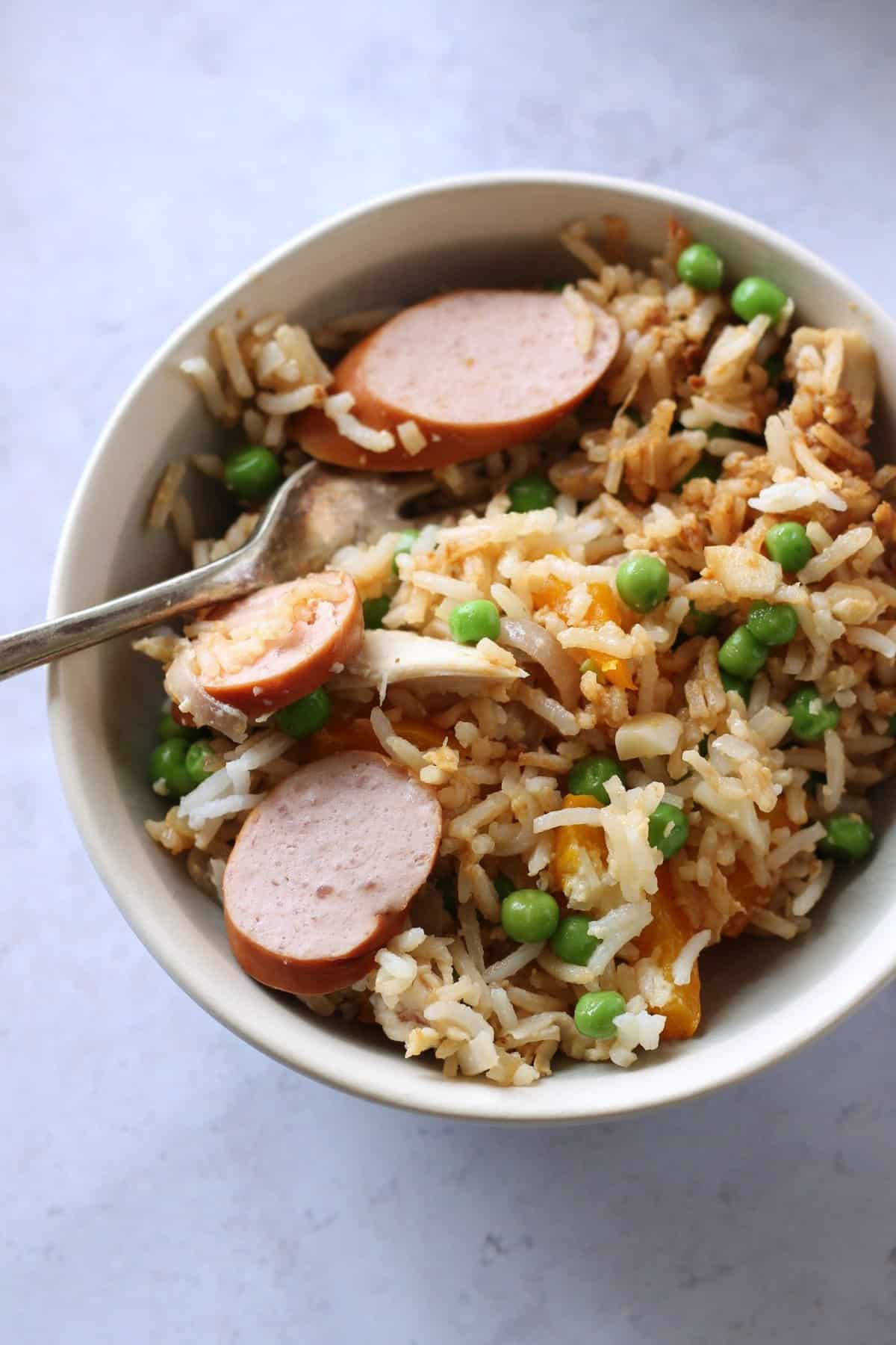  A bowl of chicken fried rice.