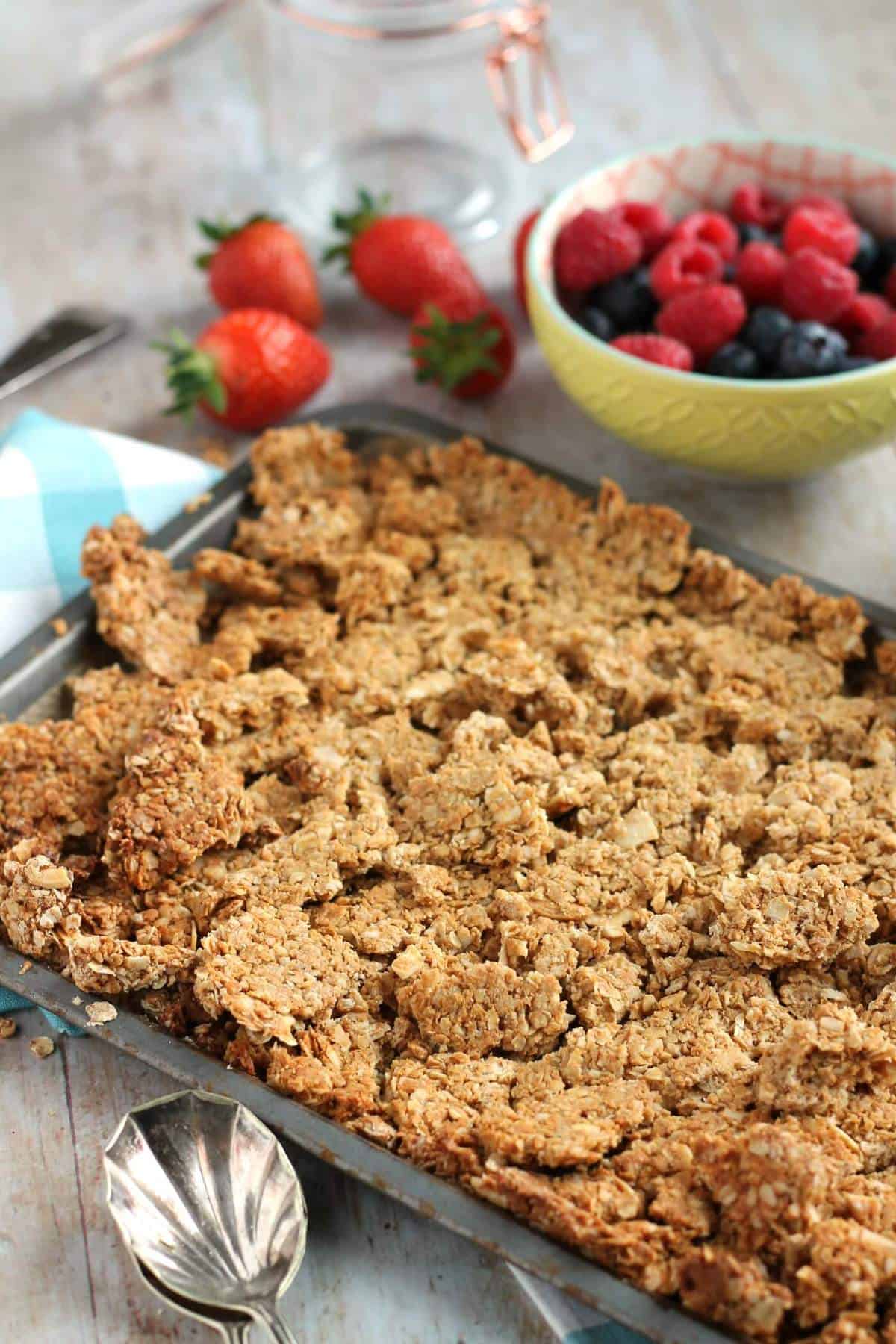 Baked granola on a baking sheet.