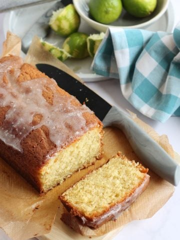 A slice of lime and coconut loaf cake