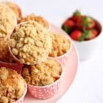 A pile of strawberry muffins on a plate