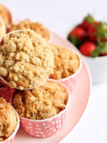 A pile of strawberry muffins on a plate