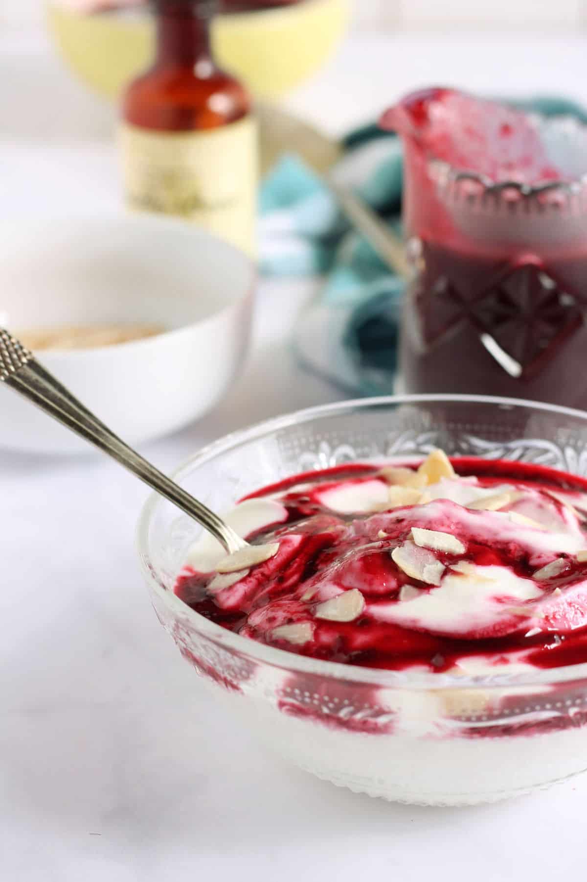 Blackcurrant coulis stirred through creamy Greek yogurt