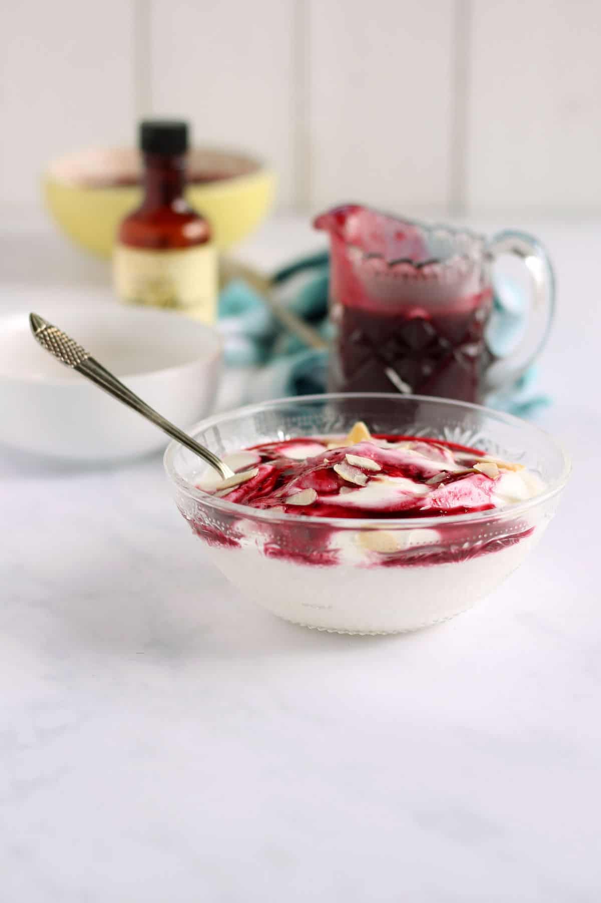 A bowl of yogurt and homemade blackcurrant sauce