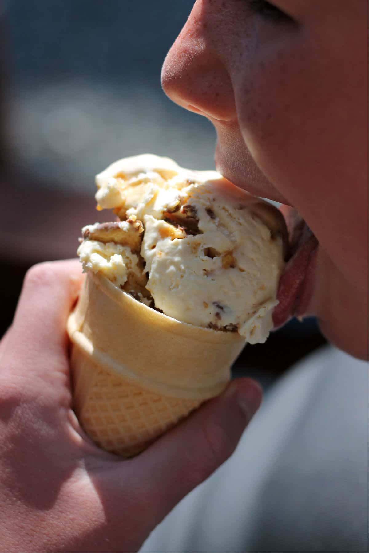 A boy licking the ice cream