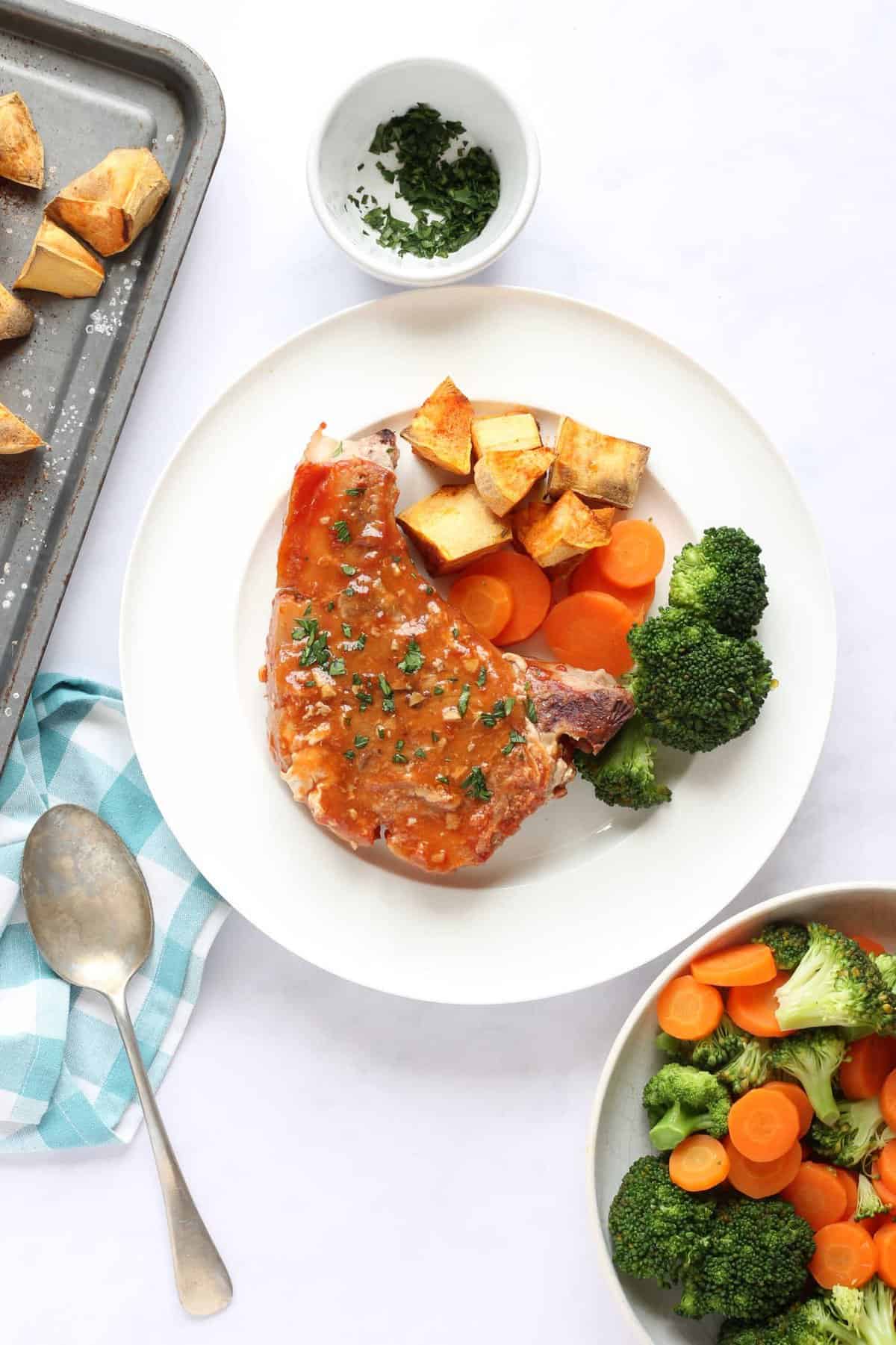 Pork chops with seasonal vegetables.