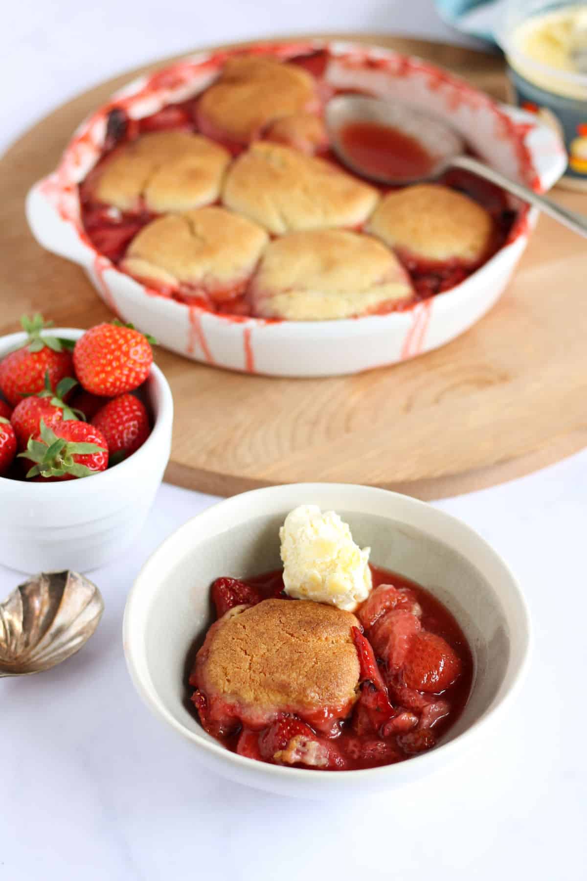 Bowl of strawberry cobbler with clotted cream