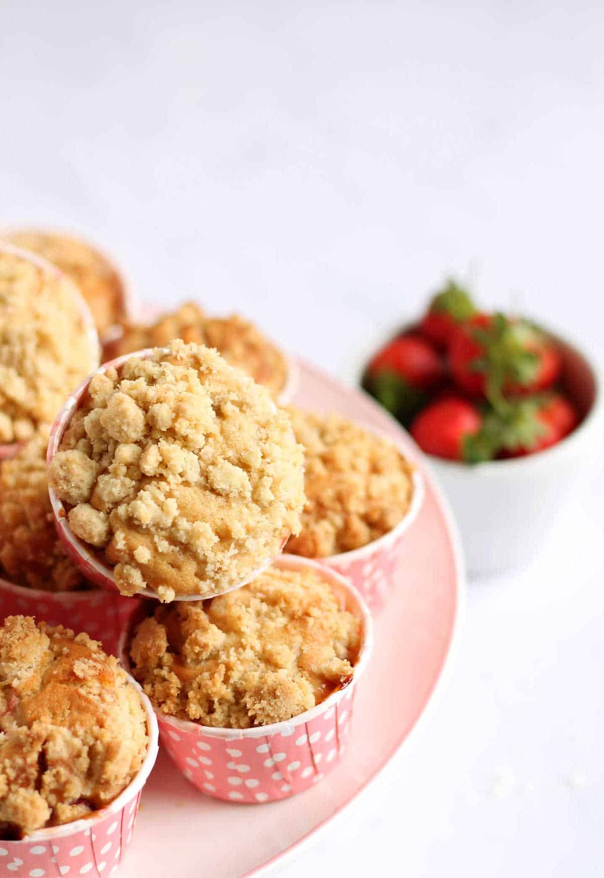 Strawberry muffins on a cake stand.