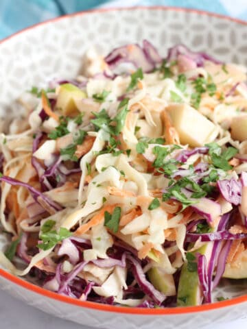 Apple coleslaw in a serving bowl.