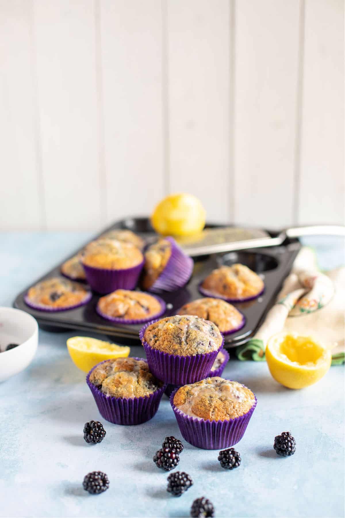 A wide shot of the muffins with the muffin tin in the background