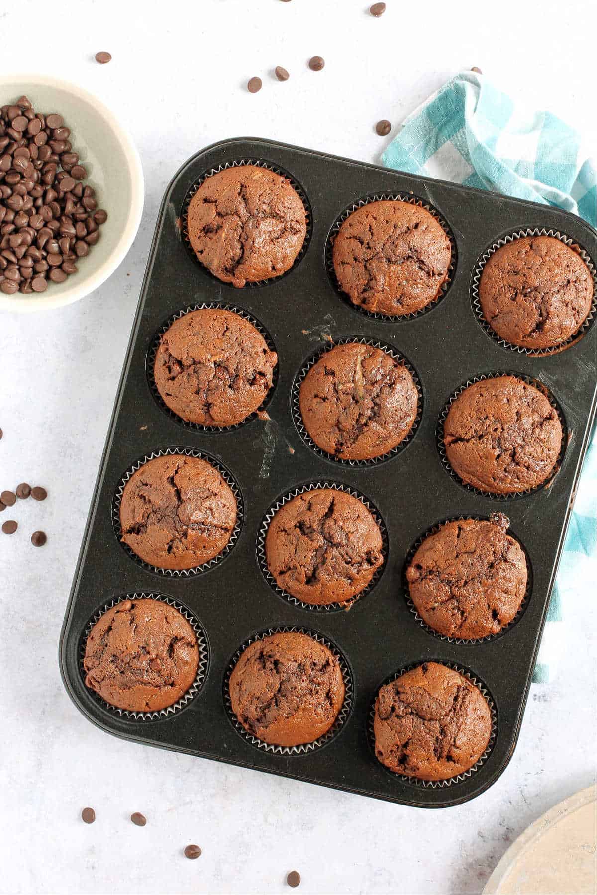 Overhead shot of muffins in a baking tin.