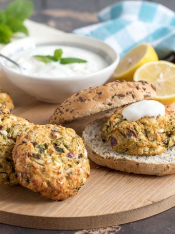 courgette and feta burgers with yogurt served in wholemeal rolls