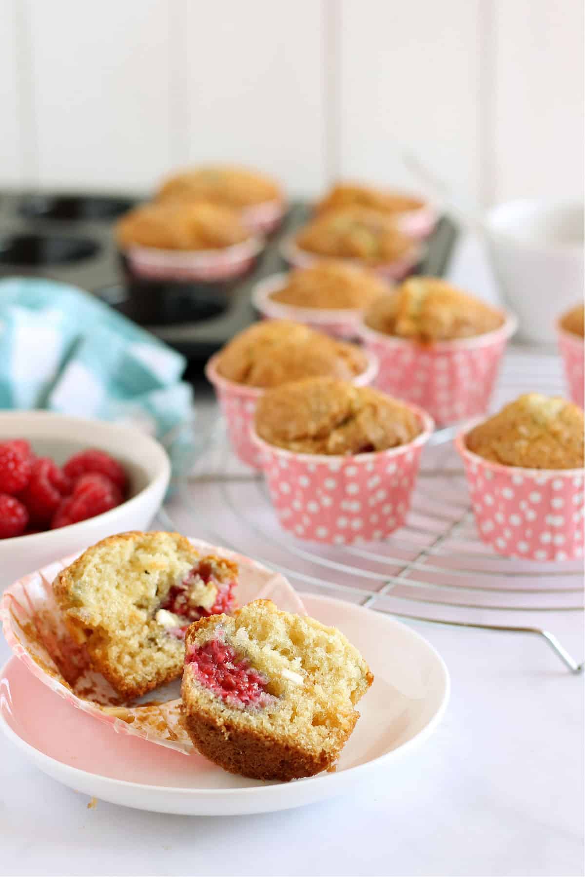 A close up of a raspberry and white chocolate muffin.