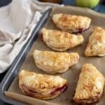 Apple and Blackberry Turnovers on a baking tray.