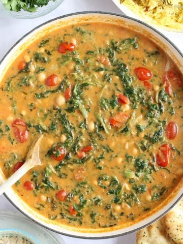 Chickpea and spinach curry in a pan.