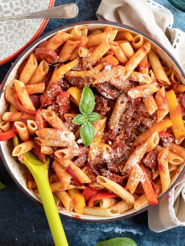 Pepper and Chorizo Pasta garnished with basil and grated Parmesan.