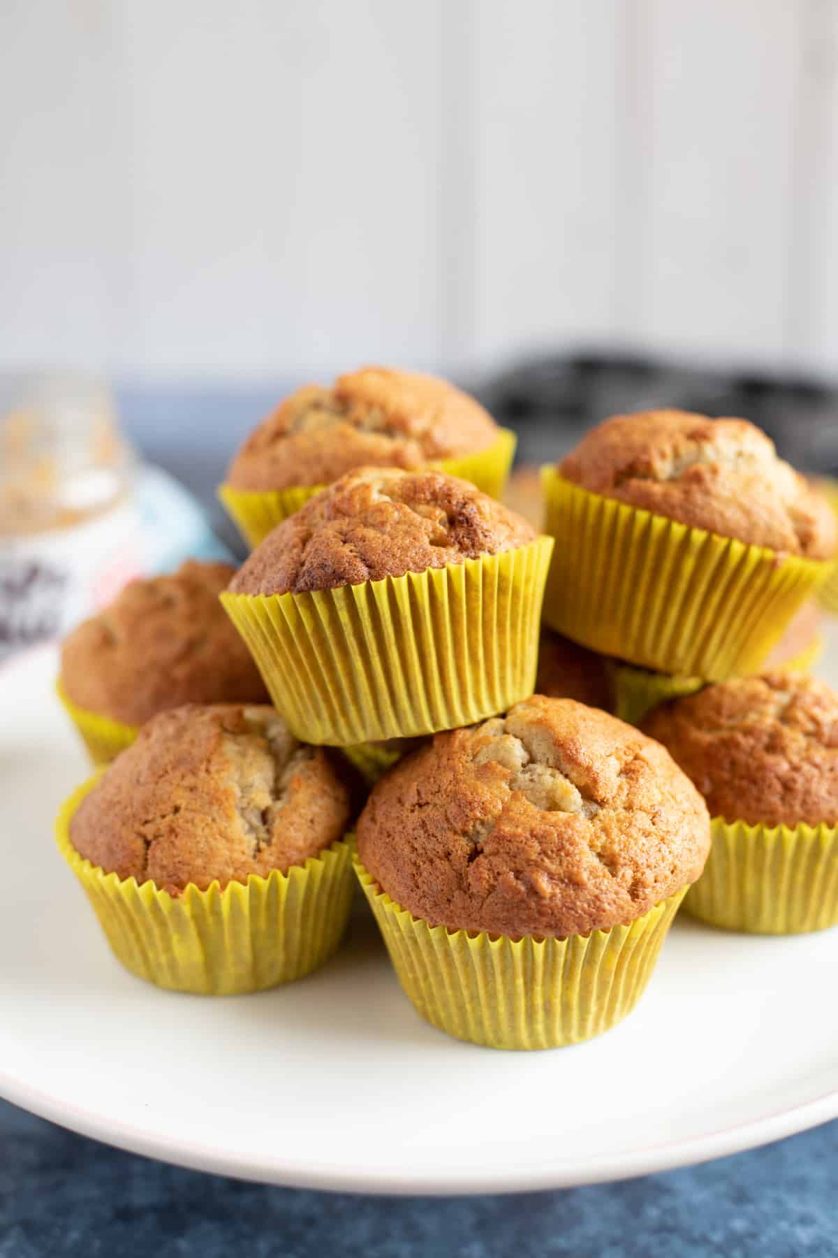 Peanut butter and banana muffins on a cake stand.