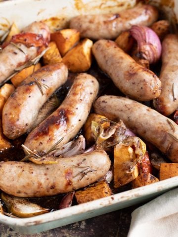 Sticky Sausage Traybake in a roasting pan.