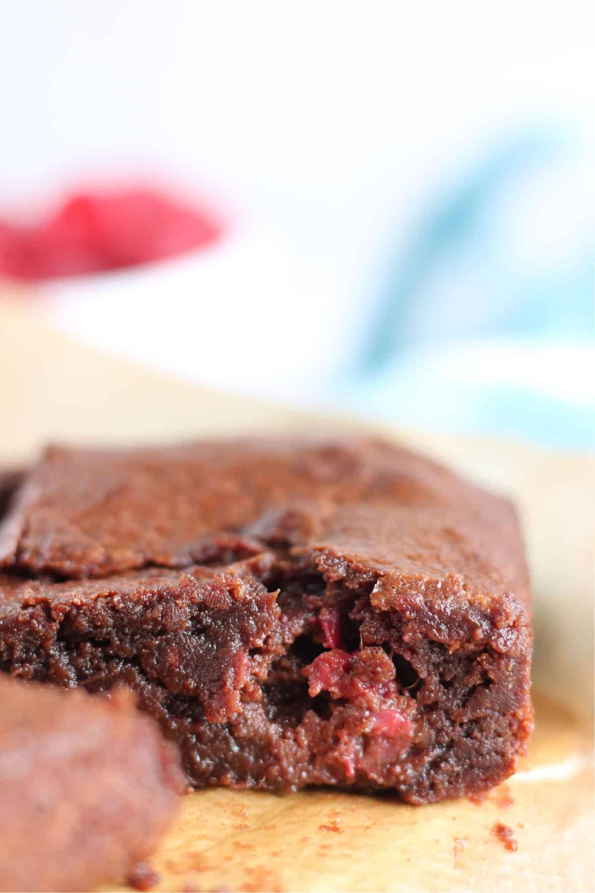 A close up of a raspberry brownies.