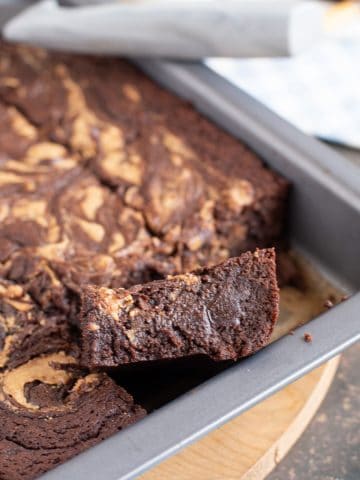peanut butter swirl brownies in a tin.