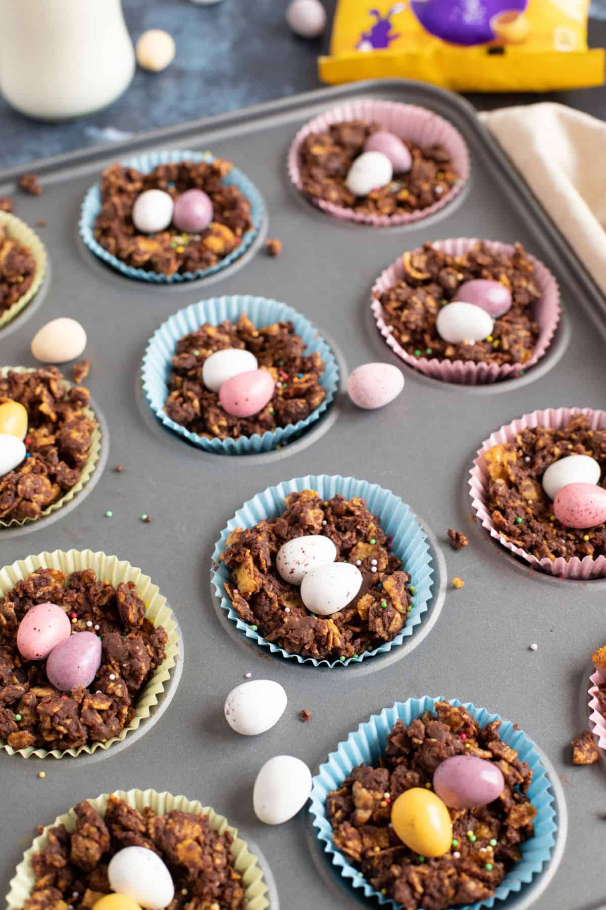 Easter chocolate cornflake nests in a bun tin.