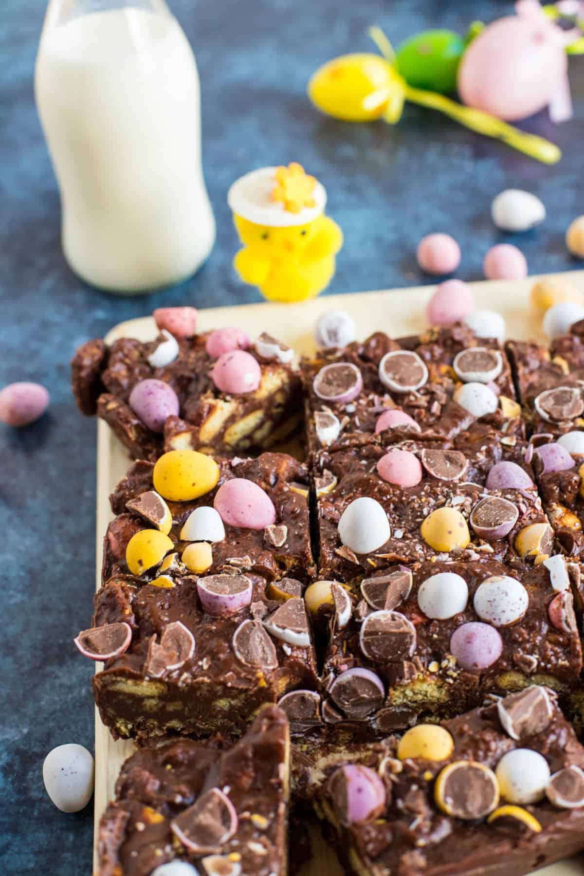 Cut slices of mini egg tiffin.