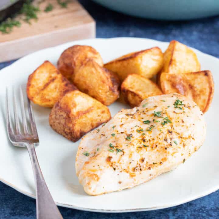 Air fryer chicken breast with crispy potatoes.