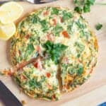 Air fryer breakfast frittata on a wooden board.