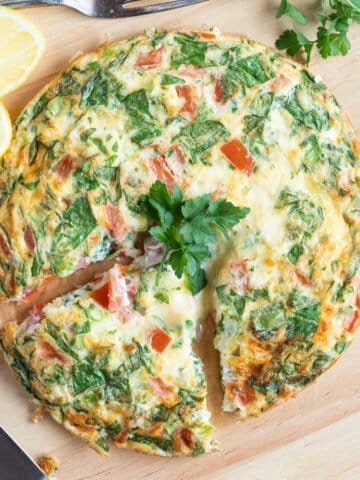 Air fryer breakfast frittata on a wooden board.