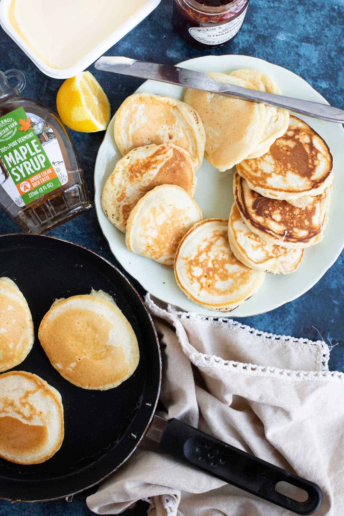 A plate of drop scones (scotch pancakes with maple syrup.