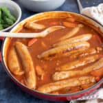 Easy sausage casserole in a red pan.