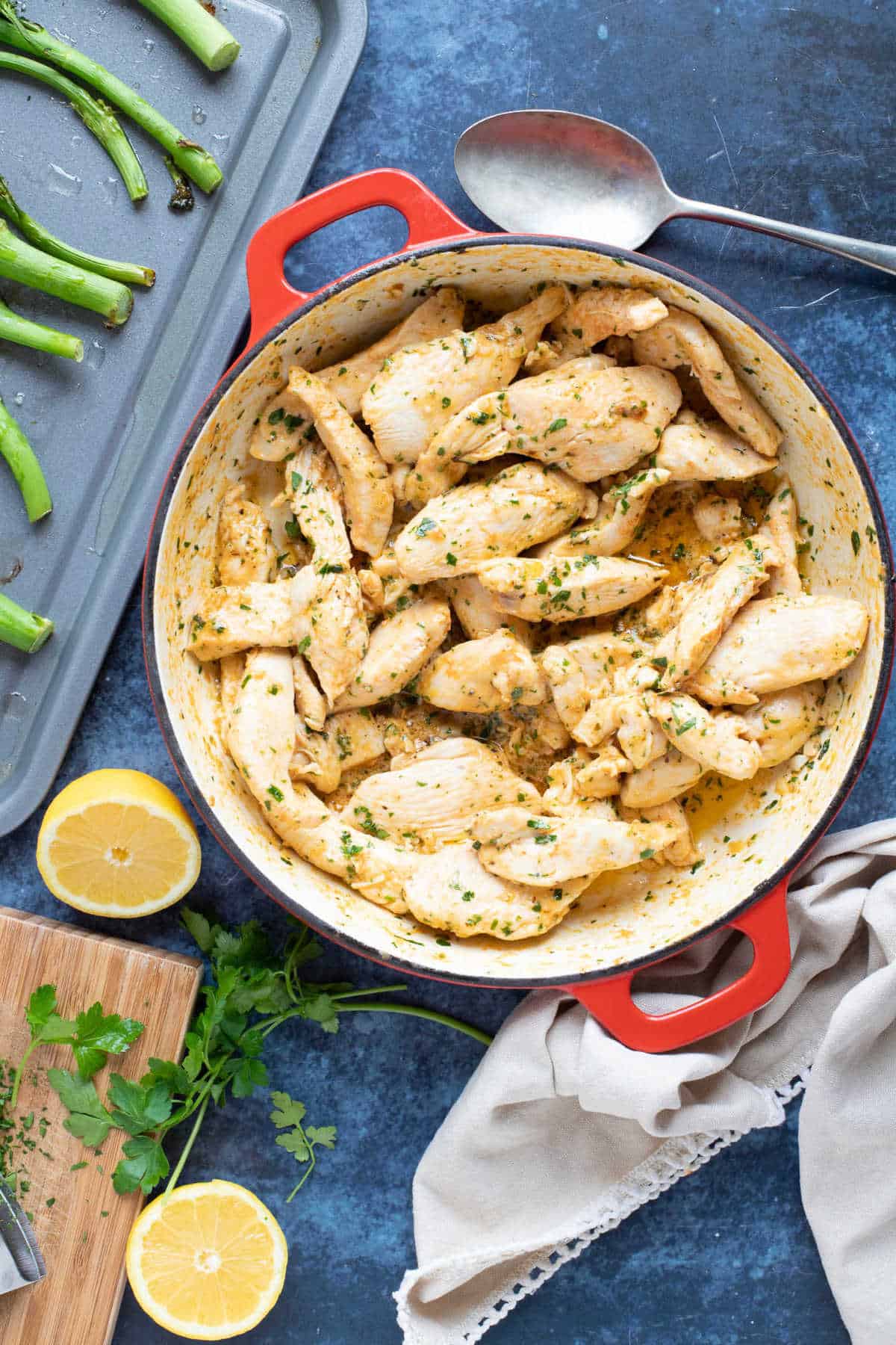 Garlic butter chicken strips garnished with parsley.