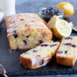 Sliced lemon polenta cake with blueberries.