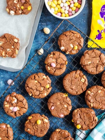 Chocolate mini egg cookies on a wire rack.