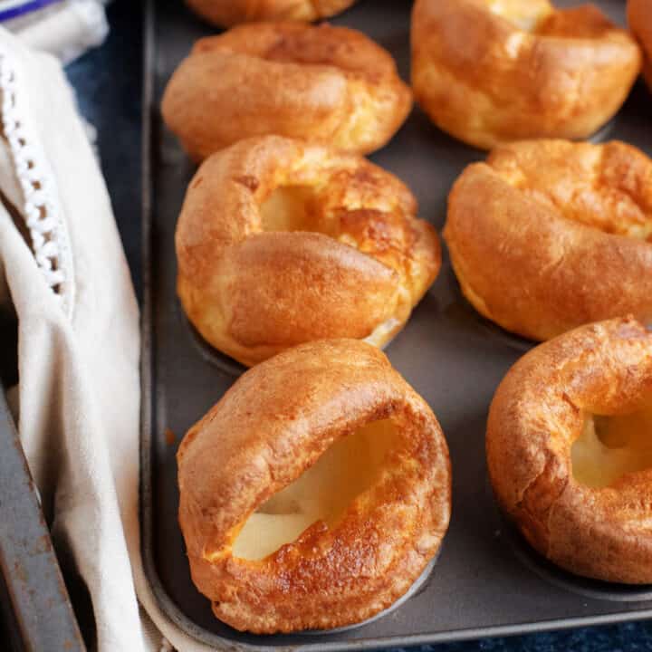 A tray of crispy golden Yorkshire puddings.
