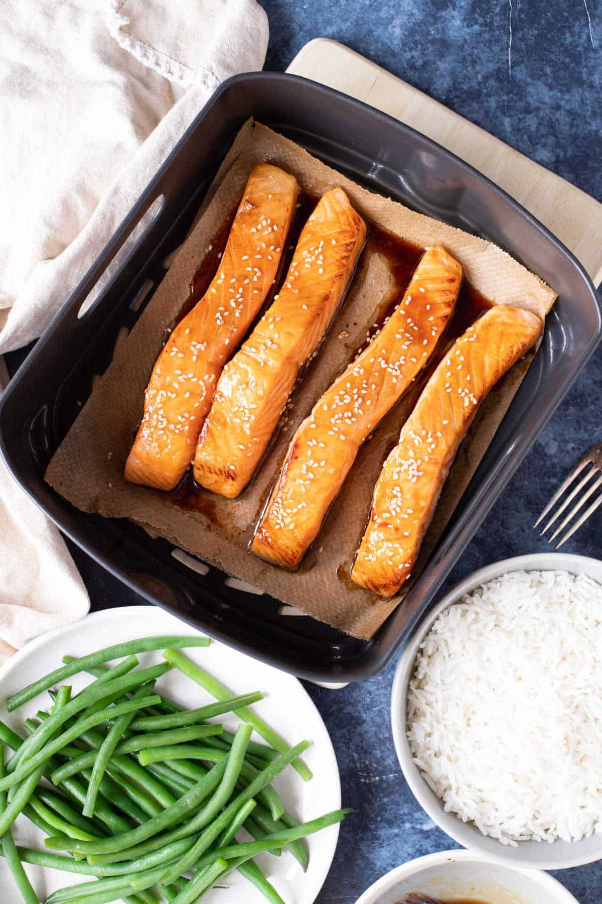 Honey glazed salmon made in the air fryer with rice and green beans.