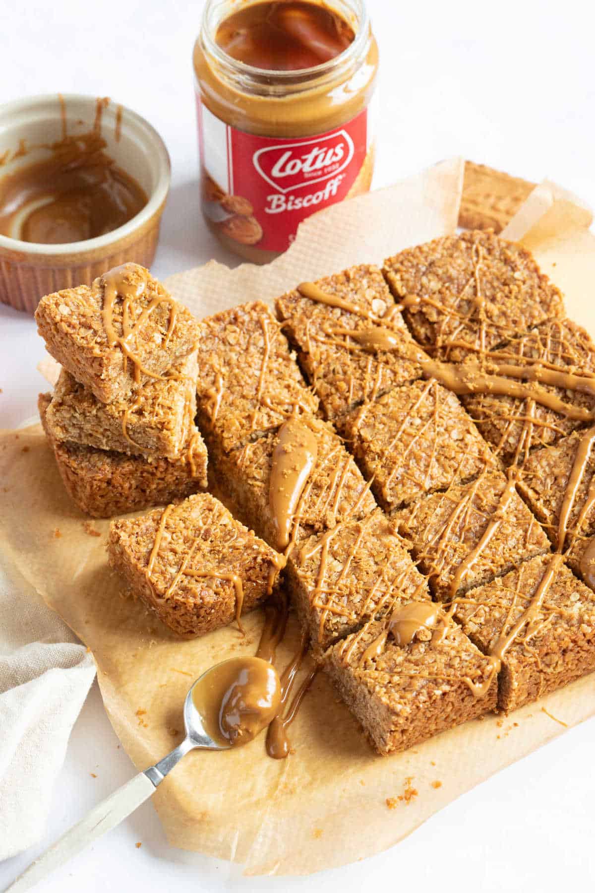 Biscoff flapjacks cut into squares and drizzled with more biscoff spread.