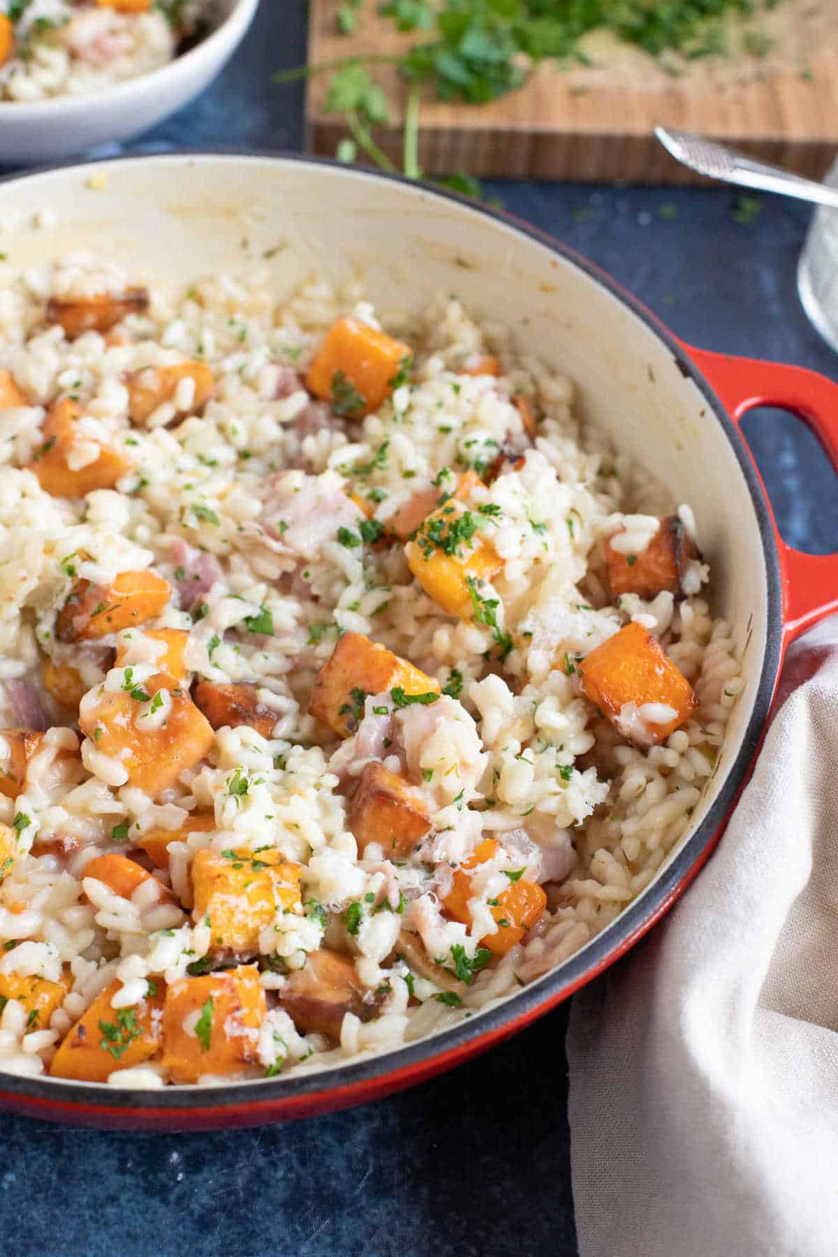 A pan of butternut squash and bacon risotto.