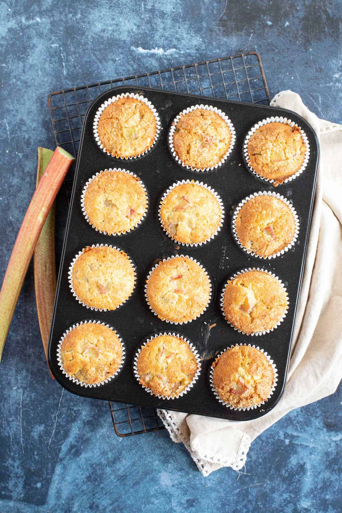 Rhubarb muffins in a muffin tray.