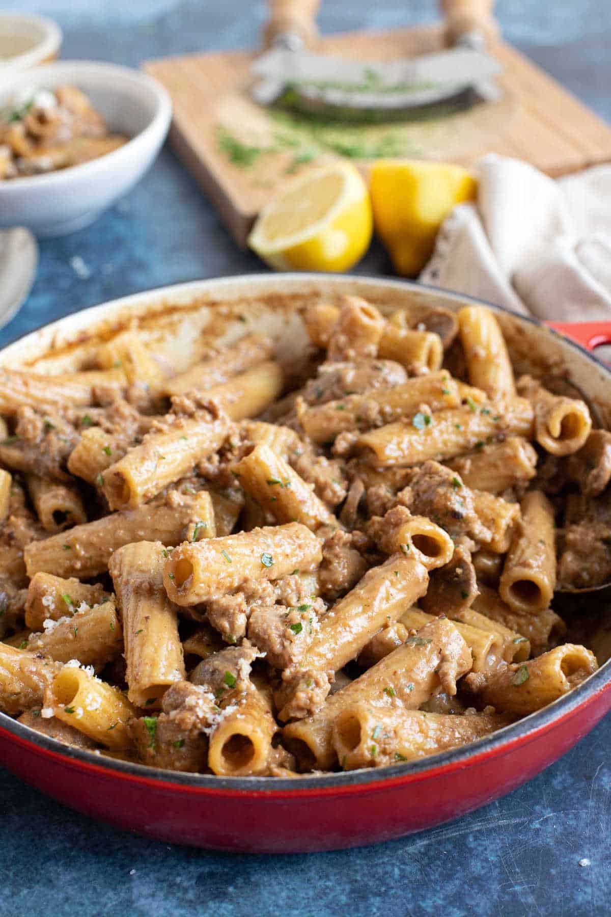 Creamy sausage pasta in a pan.