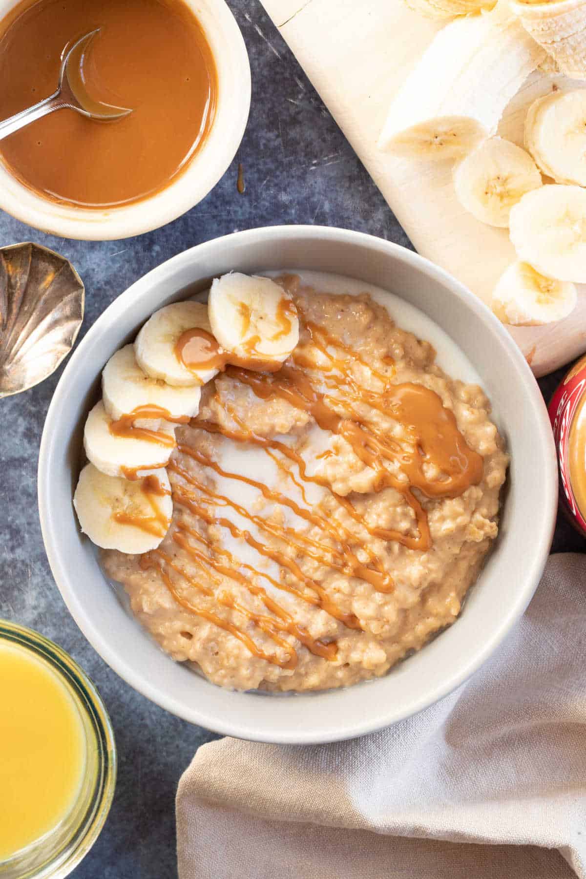 Biscoff porridge topped with chopped banana and drizzled with more biscoff spread.