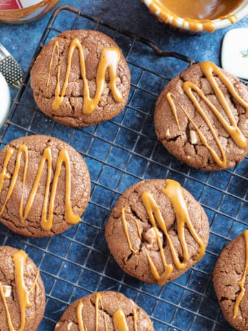 Double chocolate biscoff cookies on a cooling rack.