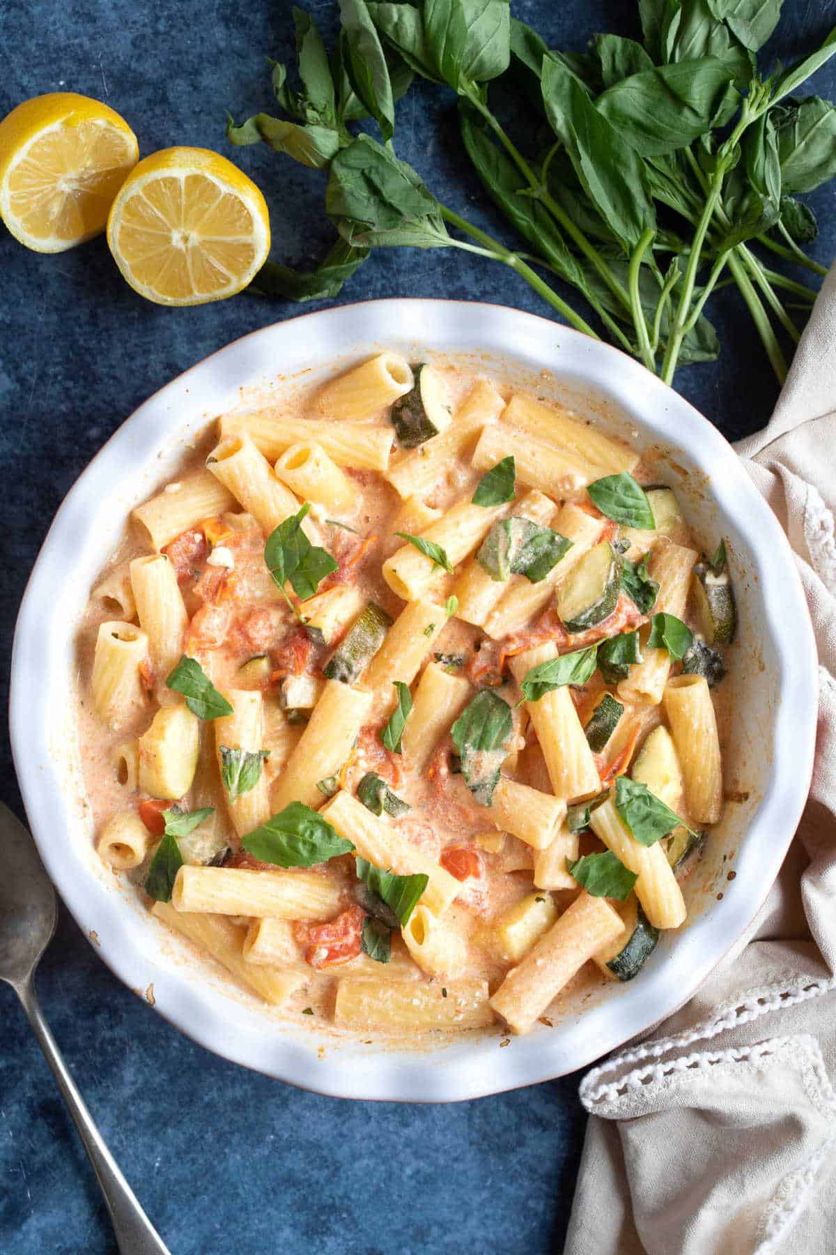 Baked feta pasta with tomatoes and courgettes.