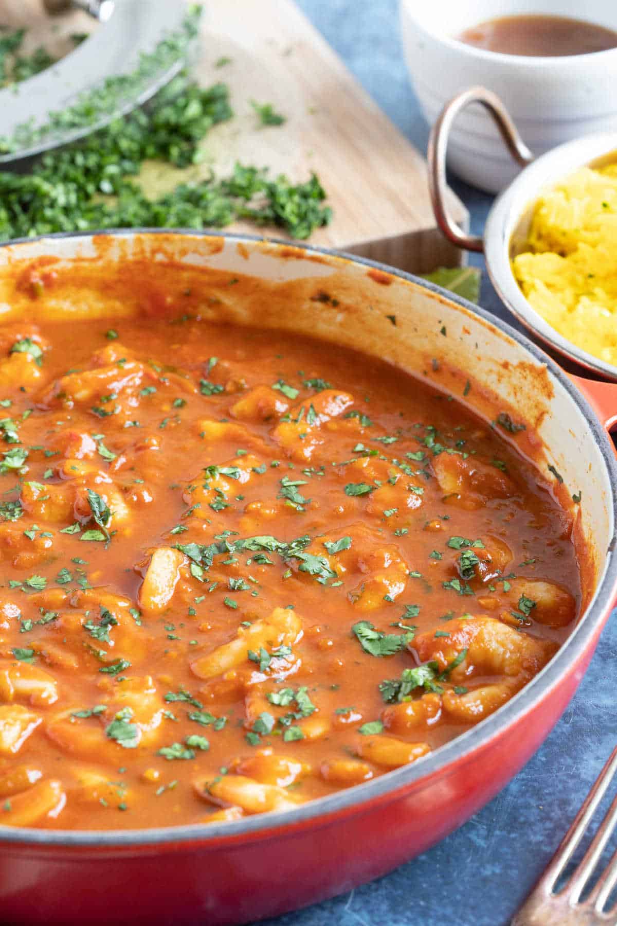 King prawn bhuna in a red pan.