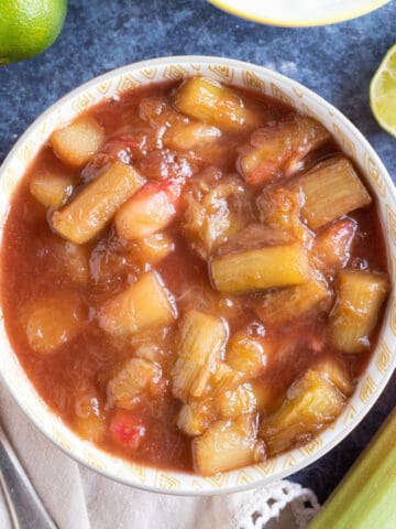Stewed rhubarb in an orange bowl.