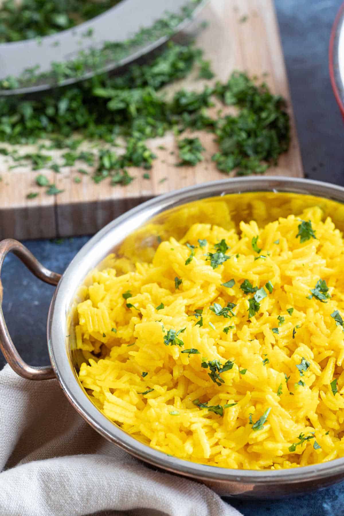 Yellow turmeric rice in a serving dish.