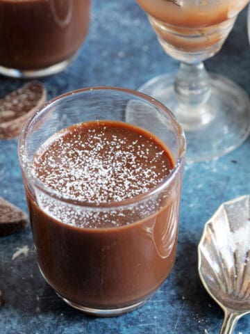 Chocolate orange pots dusted with icing sugar.