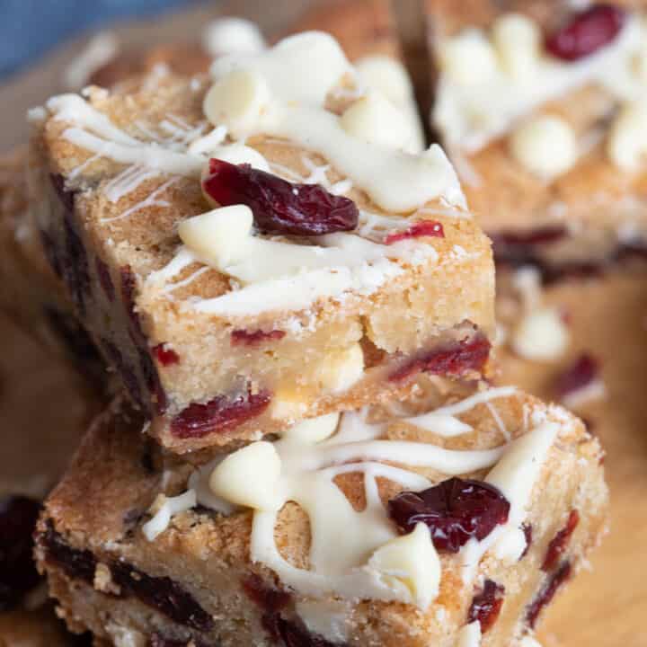 A stack of cranberry white chocolate blondies.
