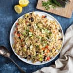 Curried rice salad on a white serving platter.