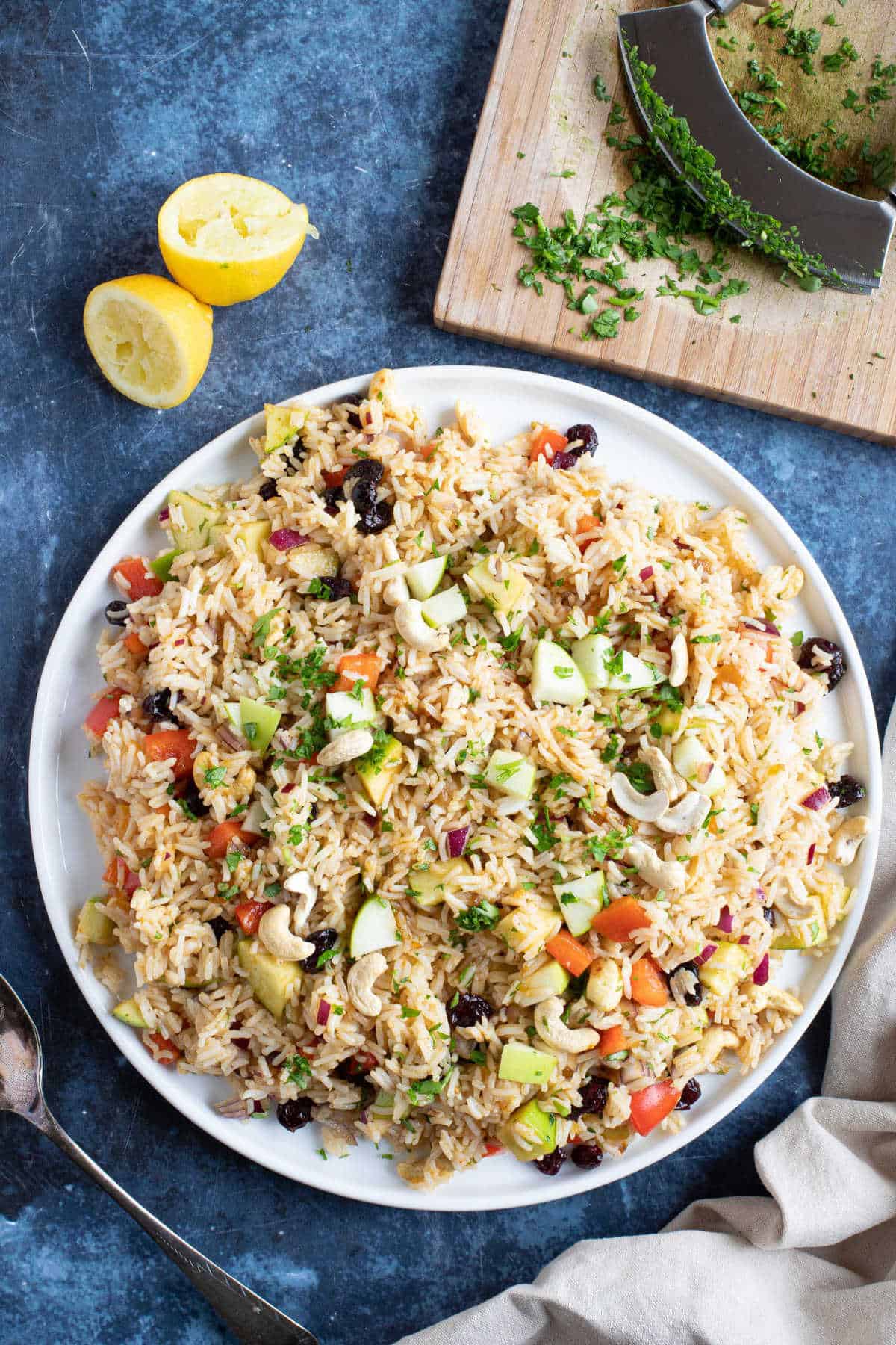 Curried rice salad on a white serving platter.