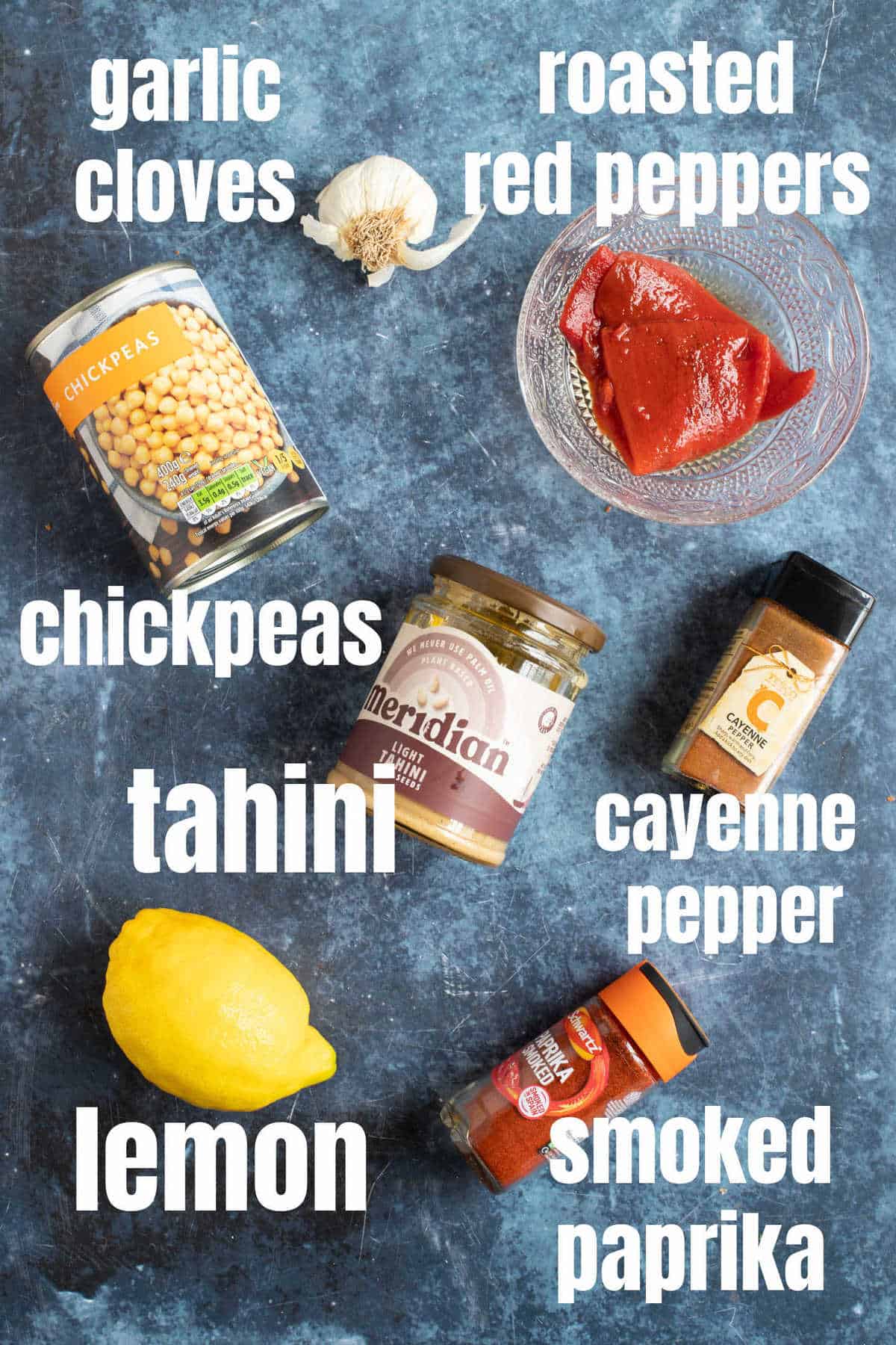 Ingredients needed to make roasted red pepper hummus.